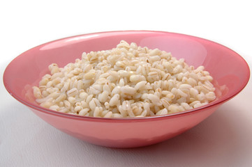 groats in plate on white