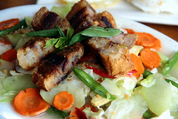 Filipino dish called Chopsuey topped with Lechon Kawali