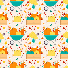 Seamless pattern with pumpkins and autumn leaves on a beige background.