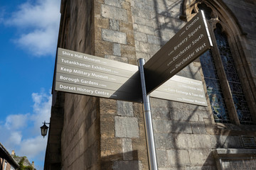 Tourist Information Street Sign Outside Church In Dorchester Dorset UK