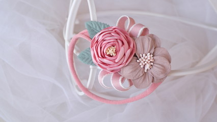 Bouquet of flowers made out of fabric cloth textile in beautiful soft pastel pink theme colors that can be used as hair accessory, decoration, and embellishment