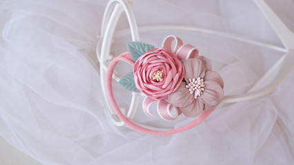 Bouquet of flowers made out of fabric cloth textile in beautiful soft pastel pink theme colors that can be used as hair accessory, decoration, and embellishment