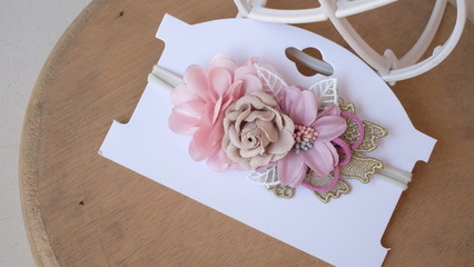 Bouquet of flowers made out of fabric cloth textile in beautiful soft pastel pink theme colors placed on card stock paper that can be used as hair accessory, decoration, and embellishment