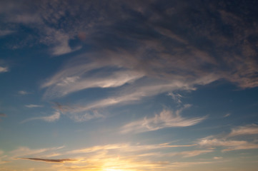 Fototapeta na wymiar feathery clouds in the evening sky