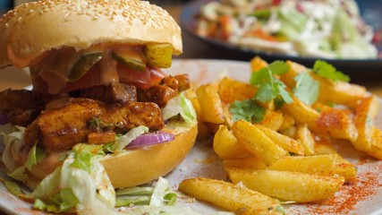 Healthy organic vegan burger served with french fries. Plant based junk food alternative.