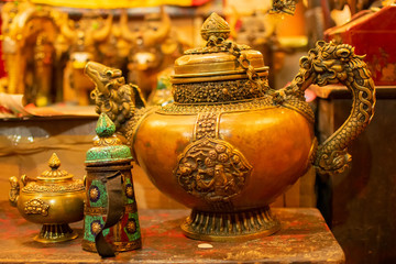 A Tibetan tea pot with chinese dargons emblemed on it, for sale at Leh market, Union territory of...