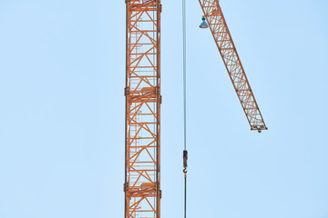 Construction crane working on building complex