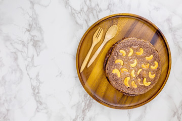 Brownie cake with nuts on circle plate