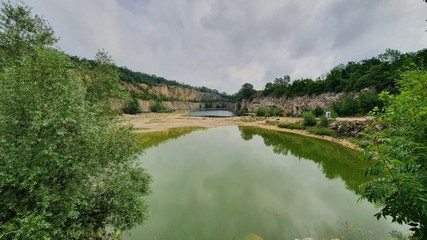 Fototapeta premium quarry lake in the forrest