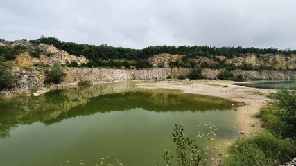 Fototapeta na wymiar quarry lake in the forrest