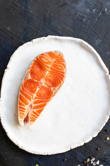 salmon red fish steak fillet seafood serving size portion product natural raw top view place copy space for text keto or paleo diet pescetarian
