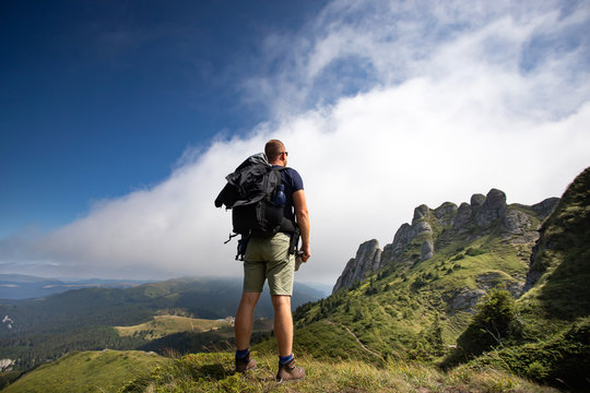Young hiker backpacker in romanian Ciucas mountains.