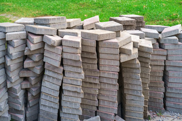 A pile of gray dirty paving tiles