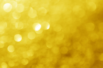 Obraz premium glitter light sparkle yellow golden gorgeous bokeh defocused abstract background shiny.