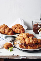 Freshly baked croissants with chocolate cream.