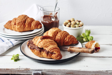 Freshly baked croissants with chocolate cream.