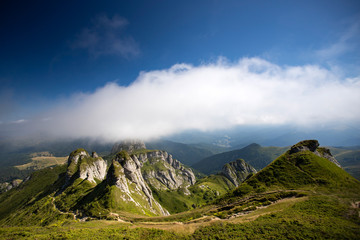Most scenic mountain from Romania, Ciucas mountains in summer mist.