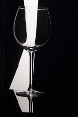 Empty wine glass on a black and white background