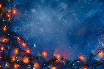 Dark blue distressed texture with glowing lights. Christmas background