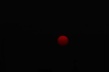 red sphere in the dark