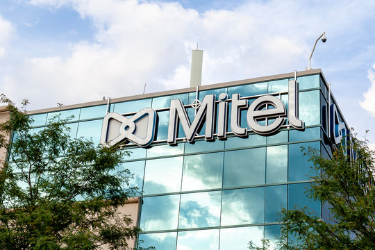 Kanata, Ontario, Canada - August 8, 2020: Mitel sign on the building at their headquarters in Kanata, Ontario, Canada. Mitel Networks Corporation is a Canadian telecommunications company.