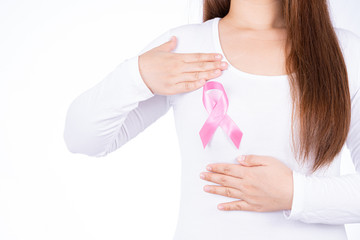 Breast cancer awareness ribbon on woman chest and doing self exam isolated over white background. Medical, healthcare for advertising concept.
