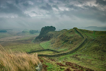 Storm clouds over Sewingshields Craggs, Hadrian's Wall, Northumberland, England. 73 miles long the...