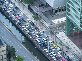 At the center of Bangkok city, contrast of weekday traffic between inbound and outbound street in the evening.
