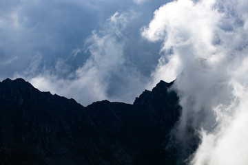 Amazing view of mountain peak in fog.