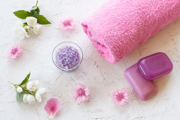 Towel and women cosmetics on a white background.