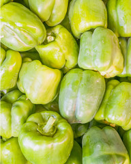colorful green peppers top view closeup, natural background