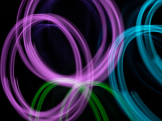 defocused purple and green neon lighting len flare background in low shutter speed condition can use for overlay, texture and background in graphic design. technology concept..