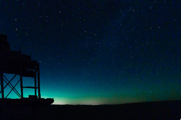 Night stars view and an old quarry