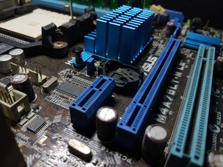 Computer Hardware. Motherboard, A close-up microchip with many electrical components placed on the...