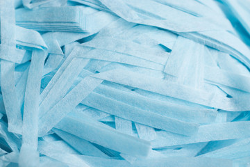 Fototapeta na wymiar Blue shredded present paper texture background