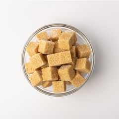 Raw Brown Cane Sugar Isolated on White Background