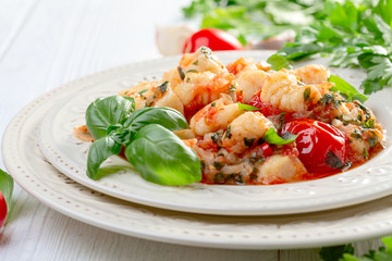 Traditional potato gnocchi with tomato sauce.