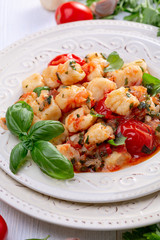 Potato gnocchi in tomato sauce. Italian cuisine.