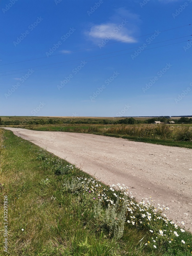 Sticker road in the field and blue sky