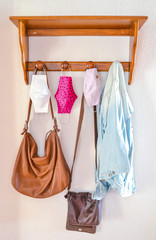 Anti Covid-19 masks hanging from a coat rack. One more complement in the day to day