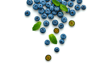 Blueberry isolated on white. Fresh blueberry closeup, healthy diet concept. Ripe organic bilberry, mint leaf creative composition. Juicy berries background, top view.