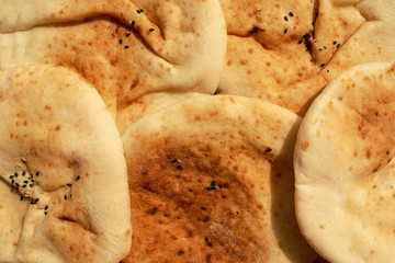 Background made of multigrain pita bread. Famous traditional Arabic flat bread. Egyptian bread.