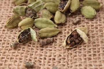 fragrant green cardamom on a jute background.