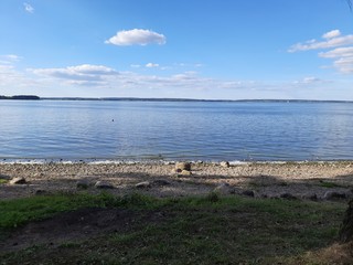 Fototapeta na wymiar Baltic Sea shore in summertime with fishing rods