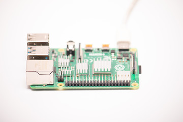 Kiev, Ukraine - August 13th, 2020: Close-up of a powered Raspberry Pi 4 Model-B on a white...