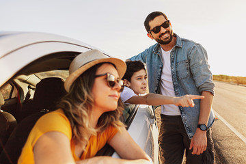 Family road trip. Latin family traveling locally by car.