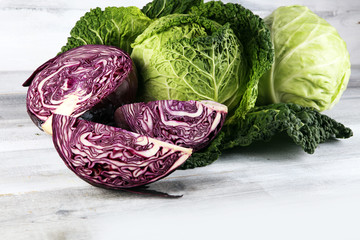 Three fresh organic cabbage heads. Antioxidant balanced diet eating with red cabbage, white cabbage and savoy