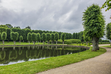 Beautiful garden in Frederiksborg Castle (Frederiksborg Slot, XVII century) - palace in Hillerod, Denmark. Frederiksborg Castle built as royal residence for King Christian IV of Denmark - Norway.