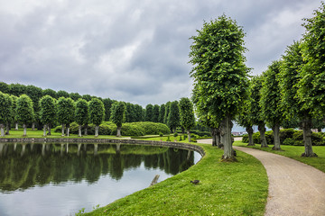 Beautiful garden in Frederiksborg Castle (Frederiksborg Slot, XVII century) - palace in Hillerod, Denmark. Frederiksborg Castle built as royal residence for King Christian IV of Denmark - Norway.