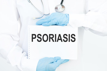 Doctor holding a tablet pc with Psoriasis sign on the display